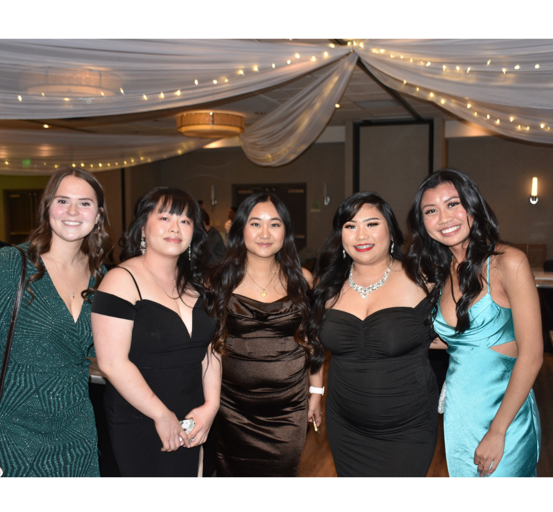 Four women smiling at Clear Lakes Dental Winter Event 2022 (Family Dentistry)