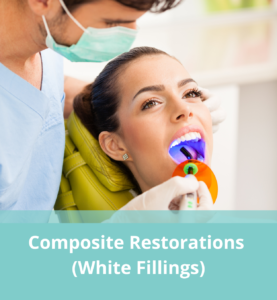 Woman receiving dental fillings, with text below reading "Composite Restorations, White Fillings)